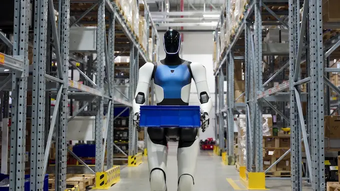 Digit humanoid robot moving totes in a busy warehouse for this Weekly Robotics News logistics story.